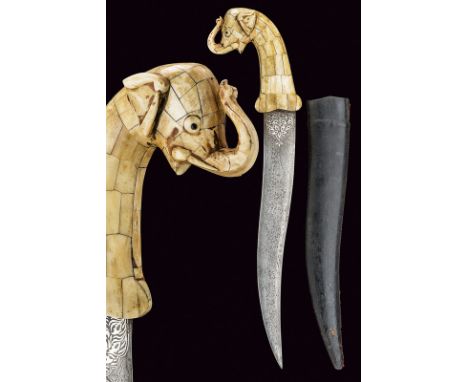 dating: Second part of the 20th Century provenance: India Flat, curved, double-edged blade with damask structure, the base en