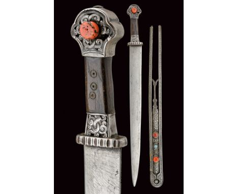 dating: 19th Century provenance: Tibet Straight, amor, single-edged blade; silver hilt with engravings, the pommel featuring 