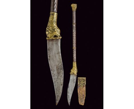 dating: mid-19th Century provenance: India Simple, single-edged blade with dotted engravings; iron haft with brass mounts, a 