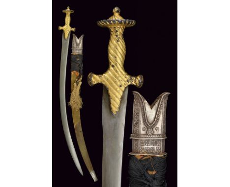 dating: circa 1800 provenance: India Curved, flat, single-and false-edge blade made of damask; typical, iron hilt worked with