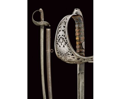 dating: circa 1900 provenance: Austria Curved blade with fuller; iron hilt with guard, richly decorated with double-headed ea