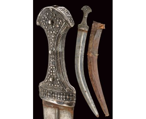 dating: 19th Century provenance: Oman Curved, double-edged blade of flat section, raised at the center. Silver grip decorated