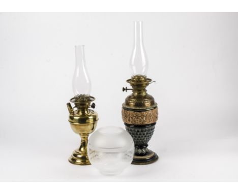 A late Victorian or Edwardian oil lamp, with a ceramic base with decorations of female Sphinx hybrid mythical creatures,  pos