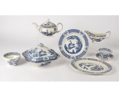 An extensive blue and white Woods and Sons dinner service,  in the 'Yuan' pattern with exotic birds amidst flowering plants, 