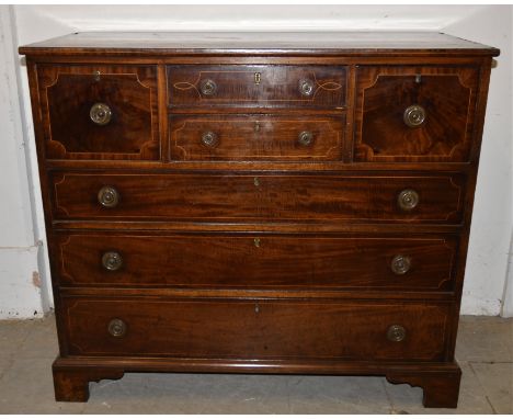 A antique mahogany chest of drawers, two short central drawers , flanked by two short deep to either side above three long gr