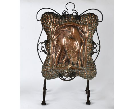 An Arts &amp; Crafts copper  fire screen, the central motif being a crane, popular in the Eastern decorative arts traditions,