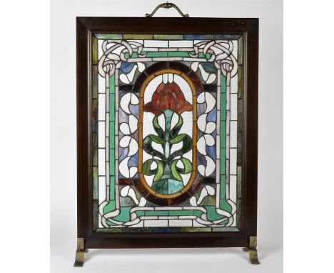 A stained glass fire screen,  with central motif of a red rose, height 76cm 
