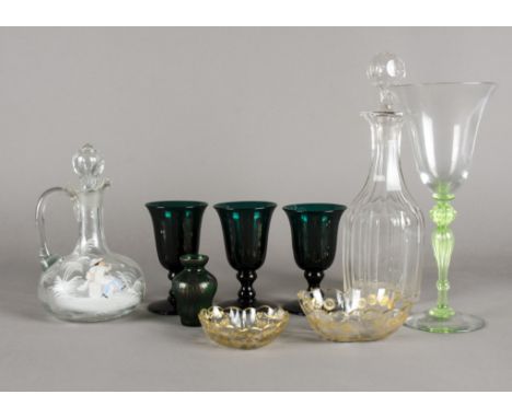 A decanter after the Mary Gregory tradition with young boy blowing a pipe,   together with several other items of antique gla