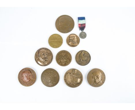 A selection of 20th Century French commemorative medallions,  featuring historical figures and landmarks, together with an ho