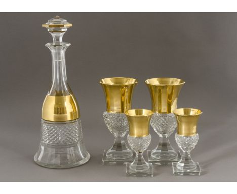 A fine heavy cut glass decanter of mallet form with gilt banded border,   hexagonal multi-faceted finial and pontil mark to t