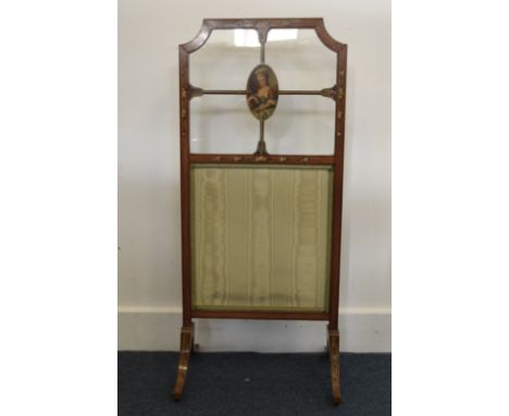 An Edwardian period Sheraton revival satinwood painted fire screen, floral decoration, four glass panels with oval central pa
