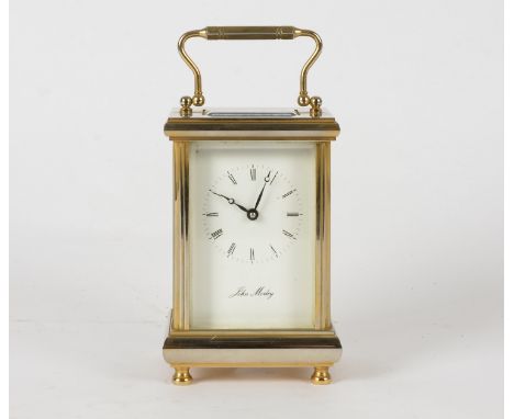 A brass carriage clock,  raised on four feet, with makers name 'John Morley', height 15cm 
