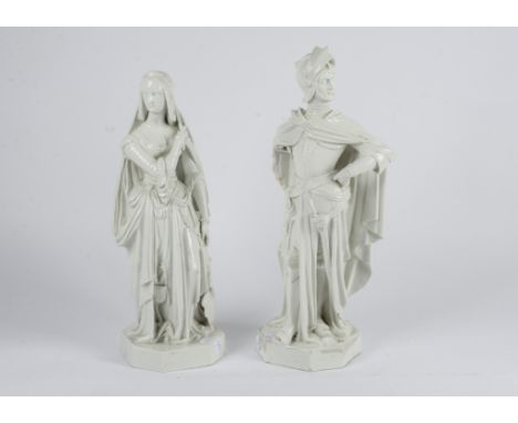 A pair of Jacob-Petit French porcelain figures,  modelled as a knight and woman in traditional attire standing upon octagonal