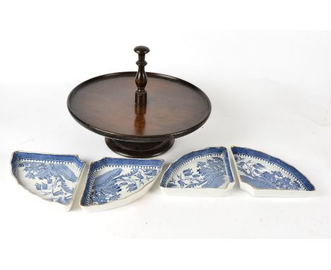 A 'lazy susan' stand with ceramic compartments, produced by Minton for Waring and Gillow, with blue and white 'Willow Pattern