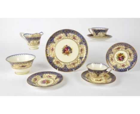 A Royal Worcester tea set,  with transfer printed design under the glaze, yet each individual piece hand decorated with flora