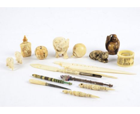 Several antique ivory elephant carvings,  tallest 4.5cm, together with a double gourd shaped pierced pomander type container,