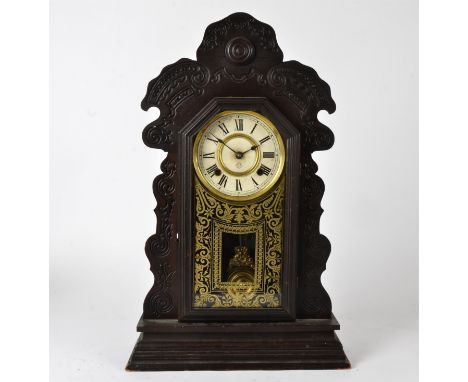 An American ginger bread surround mantle clock,  marked for the 'Ansonia Clock Company Manufacturers' USA, with enamel dial a