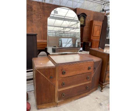 AN ART DECO DRESSING CHEST ENCLOSING THREE DRAWERS AND TWO CUPBOARDS 46" WIDE 