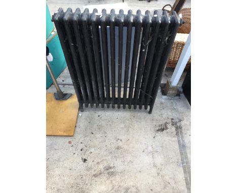 A VINTAGE HEAVY CAST IRON RADIATOR 