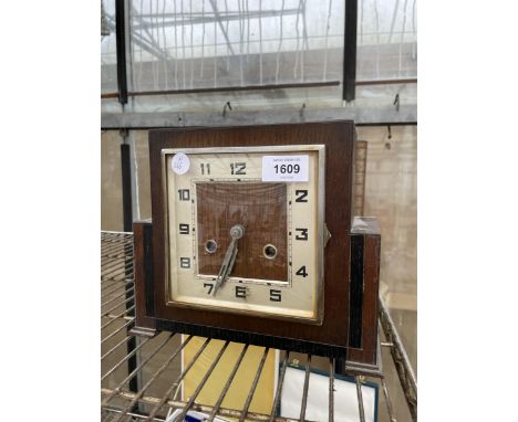AN OAK CASED ART DECO CHIMING MANTLE CLOCK 