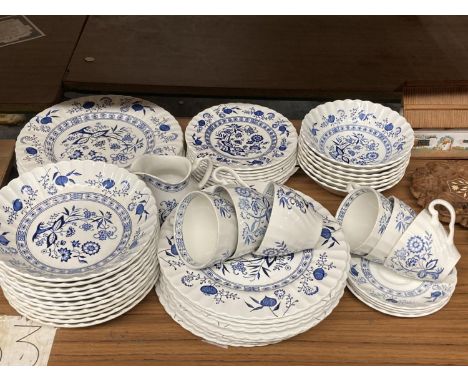 A J &amp; G MEAKIN 'BLUE NORDIC' PART DINNER SERVICE TO INCLUDE VARIOUS SIZES OF PLATES, BOWLS, A CREAM JUG, CUPS AND SAUCERS