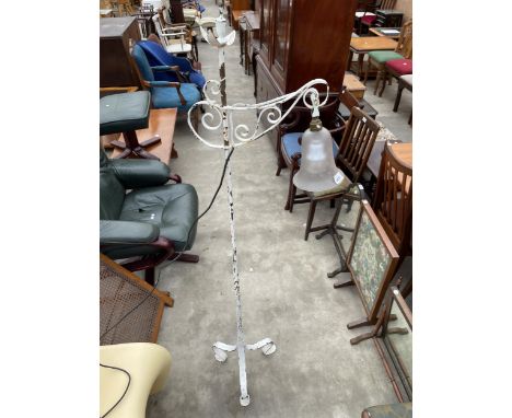 A CAST AND WROUGHT IRON STANDARD LAMP ON TRIPOD BASE WITH PRETTY SMOKED GLASS SHADE 
