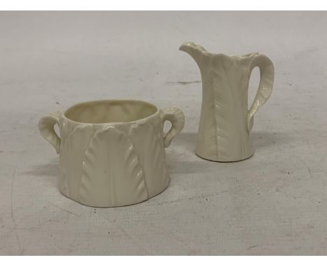 TWO ROYAL WORCESTER ITEMS TO INCLUDE A TWIN HANDLED SUGAR BOWL AND CREAM JUG ONE MARKED RN211929 1667 