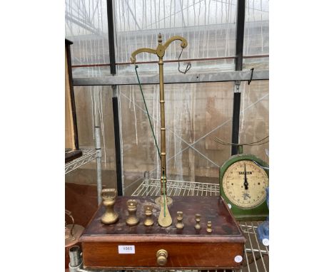 A SET OF VINTAGE BRASS SCALES WITH LOWER MAHOGANY DRAWER AND BRASS BELL WEIGHTS 