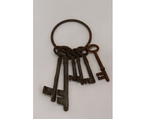 A SET OF SIX LARGE VINTAGE KEYS ON A RING 