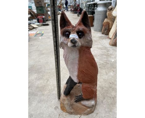 A CHAINSAW CARVED SITTING FOX (H:65CM) 