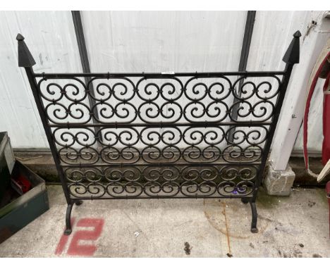 A DECORATIVE WROUGHT IRON FIRE SCREEN 