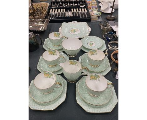 A VINTAGE PARAGON TEASET TO INCLUDE A CAKE PLATE, CREAM JUG, SUGAR BOWL, CUPS SAUCERS AND SIDE PLATES 