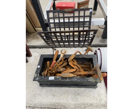 A METAL MAGAZINE RACK AND AN ASSORTMENT OF TOOLS TO INCLUDE SPANNERS AND BRACE DRILLS ETC 