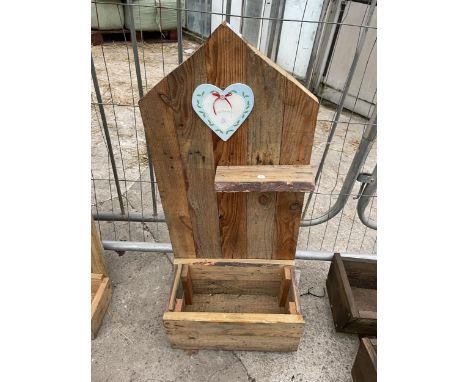 A DECORATIVE WOODEN WALL SHELF WITH  LOWER PLANTER 