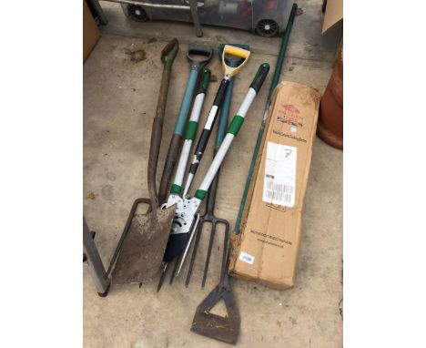 AN ASSORTMENT OF TOOLS TO INCLUDE FORKS, A SPADE AND A COLUMN PARKING BARRIER ETC 