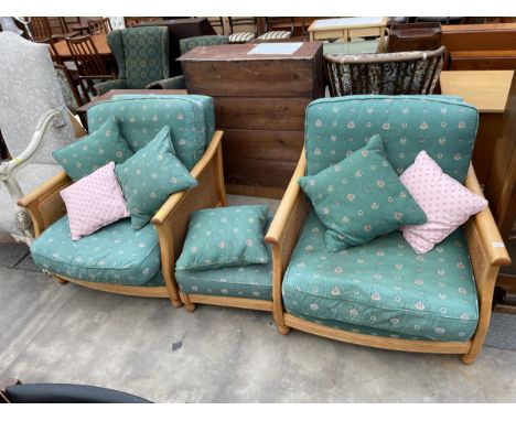 A PAIR OF ERCOL LIGHT OAK BERGERE EASY CHAIRS AND MATCHING STOOL 