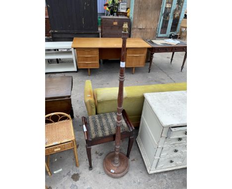 AN OAK STANDARD LAMP AND A PIANO STOOL 