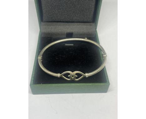 A SILVER CELTIC BANGLE 