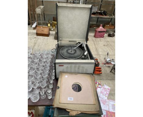 A VINTAGE HACKER PORTABLE RECORD PLAYER WITH AN ASSORTMENT OF LP RECORDS 