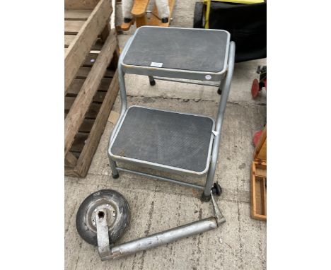 A METAL NON SLIP KITCHEN STEP AND A JOCKEY WHEEL 
