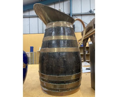 A VERY LARGE VINTAGE OAK AND BRASS BANDED EWER 