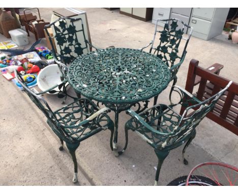 A VINTAGE CAST ALLOY BISTRO SET COMPRISING OF A ROUND TABLE AND FOUR CHAIRS 