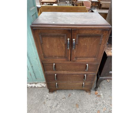AN ART DECO OAK TALLBOY WITH CUPBOARD AND THREE DRAWERS 30" WIDE 
