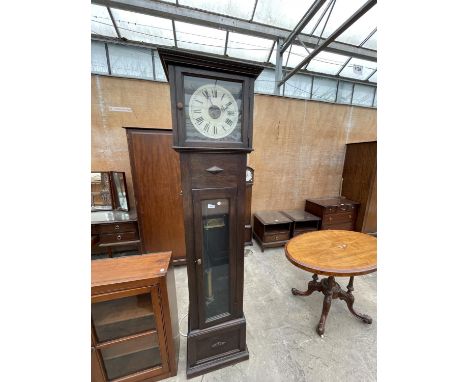 AN EARLY 20TH CENTURY OAK ELECTRIC LONGCASE CLOCK WITH BLACK AND WHITE FACE HAVING ROMAN NUMERALS WITH GLASS DOOR 