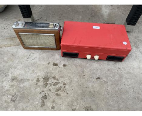 A PORTABLE STEEPLETONE RECORD PLAYER AND A VINTAGE BUSH RADIO 