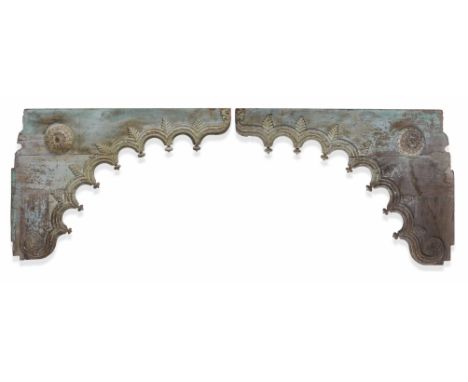 A PAIR OF ANTIQUE INDIAN CARVED WOODEN ARCHITECTURAL BRACKETS decorated with leaves, flowerheads and turned finials, each bra