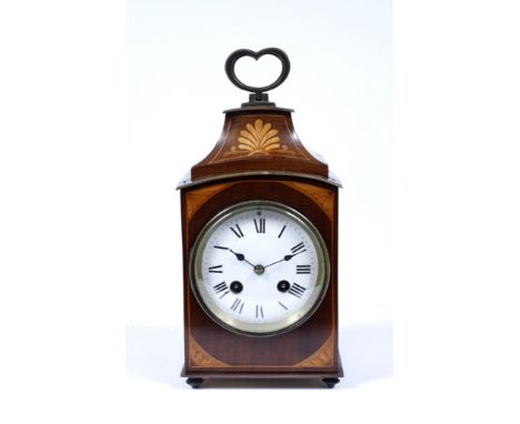 AN ANTIQUE MAHOGANY CASED MANTLE CLOCK, the case with boxwood inlay and decorative stringing and brass mounts and hinged hear