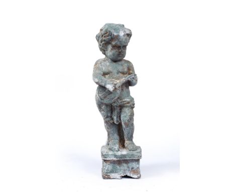 AN OLD CAST IRON SCULPTURE OF A CHERUB playing a lute, 28cm in height