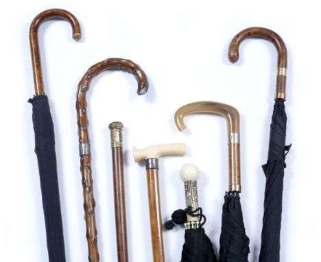 A GROUP OF FOUR E FOX AND CO LIMITED UMBRELLAS to include an art deco umbrella with ivory ball finial and also a malacca walk