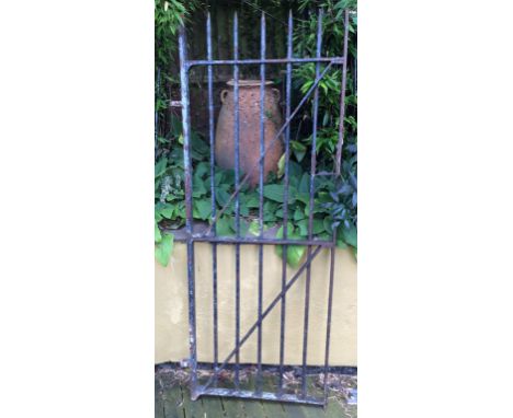 AN IRON GATE, 204cm high by 82cm wide 